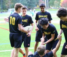 a group of rugby players in the field