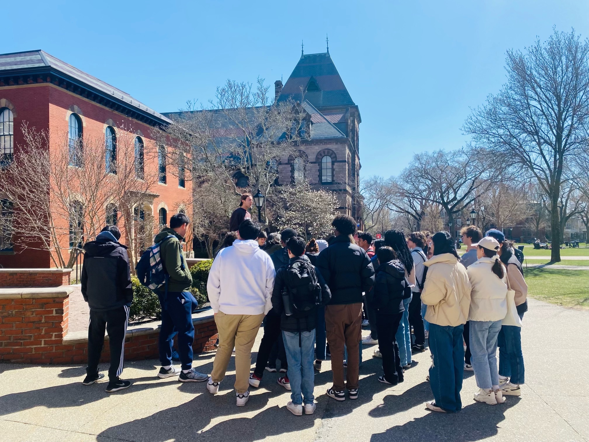 Students listening to a tour guide at Brown University.