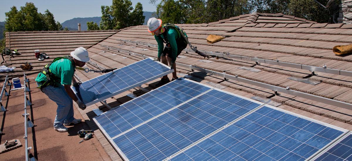 Students installing solar panels