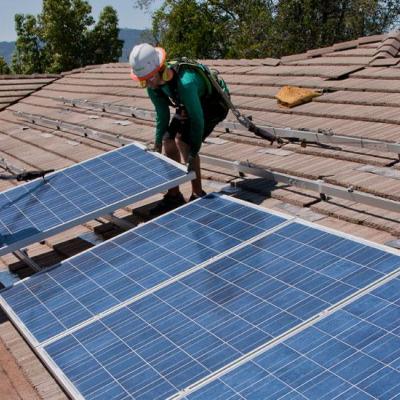 Students installing solar panels