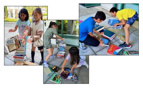 Students stacking discarded books