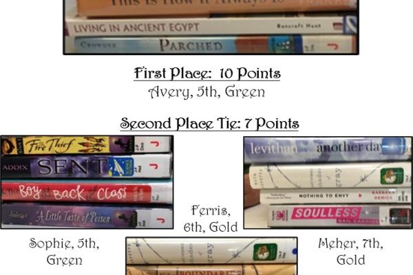 Winners of the Book Spine Poetry contest; books stacked to show their titles making a poem